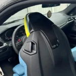BMW G80 M3 / G82 M4 carbon fibre seat back cover installed – gloss pre-preg carbon trim on OEM bucket seat, interior detail upgrade