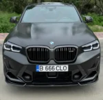 Installed BMW X4M LCI carbon fibre front bumper trims – dry carbon vent covers fitted for OEM+ performance look
