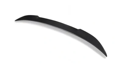 Curved angle of BMW G80/G20 CS Style rear spoiler in carbon fibre, showing V-kick and contoured design