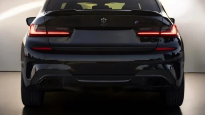 Straight rear view of BMW M3 G80 with CS Style carbon fibre spoiler installed, emphasizing fit and finish