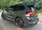 Side angle view of BMW X5M F95 carbon fibre rocker extensions – ASM Performance aerodynamic design
