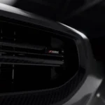 Focused view of the ASM emblem on the front grille bar