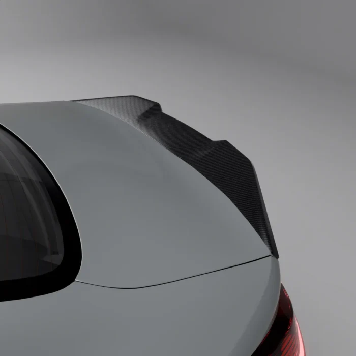 Top close-up of carbon fibre spoiler on BMW G82 M4 trunk