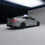 Rear side angle showing carbon spoiler, diffuser, and side skirts