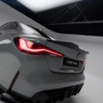 Close-up of left tail light and ASM carbon diffuser on grey BMW M4 G82