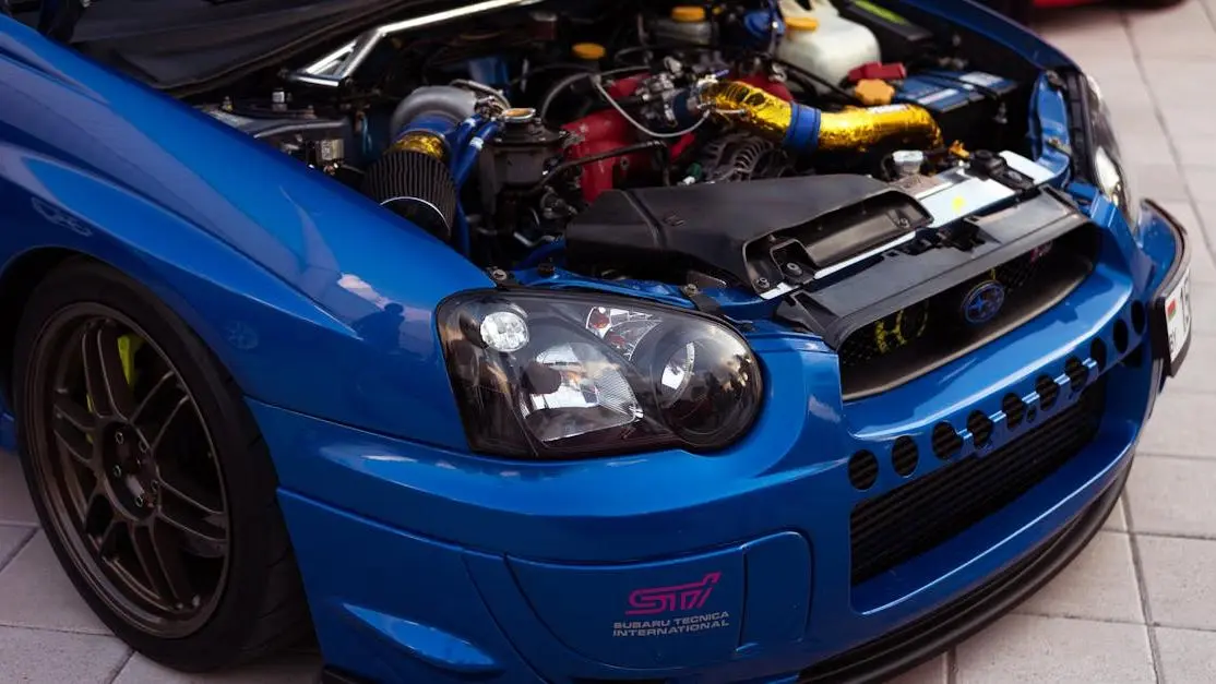 Subaru Impreza Engine Highlighting Intercooler Leak Symptoms In A Vibrant Blue Livery.