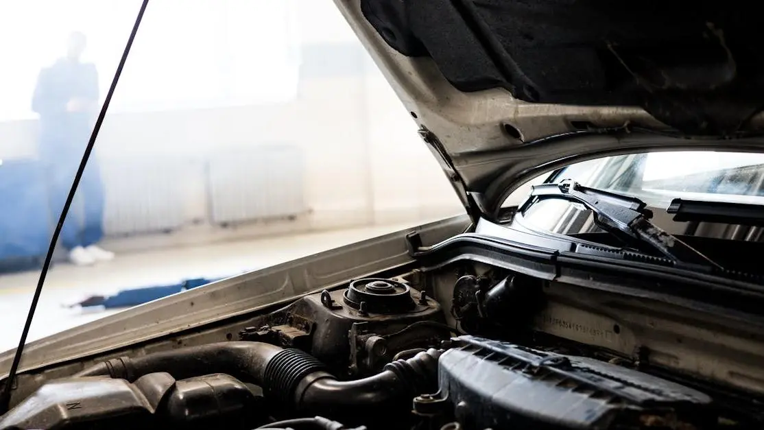 Car engine comparison for stage 1 vs stage 2 tuning under hood in garage setting