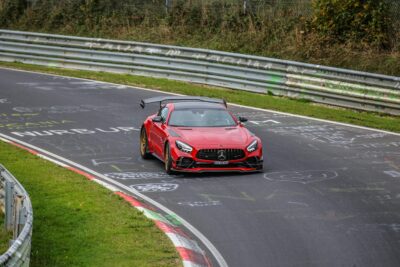 Mercedes-Amg Gt With Full Carbon-Fibre Aero Kit Including Front Splitter, Diffuser, And Rear Wing Taking A Corner On Track Day