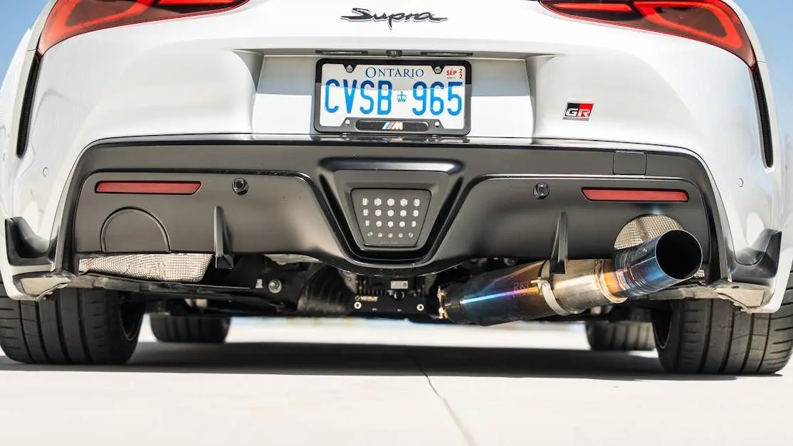 Toyota Supra with aftermarket automotive exhaust systems and Ontario license plate