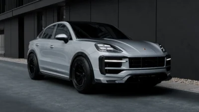 Porsche Cayenne Turbo GT Coupé Carbon Front Splitter Lip – ASM Design Porsche Cayenne Turbo GT with full carbon splitter – front angle in low-light urban settings